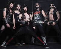 Five adults with long hair wearing rock-style clothing and accessories pose confidently against a dark background. Description generated by AI