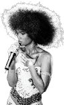 Person with large afro hairstyle wearing a sequined outfit is singing into a microphone on stage. Description generated by AI