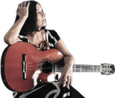 A person with shoulder-length hair wearing a striped top and patterned skirt is sitting while holding an acoustic guitar and looking to the side. Description generated by AI